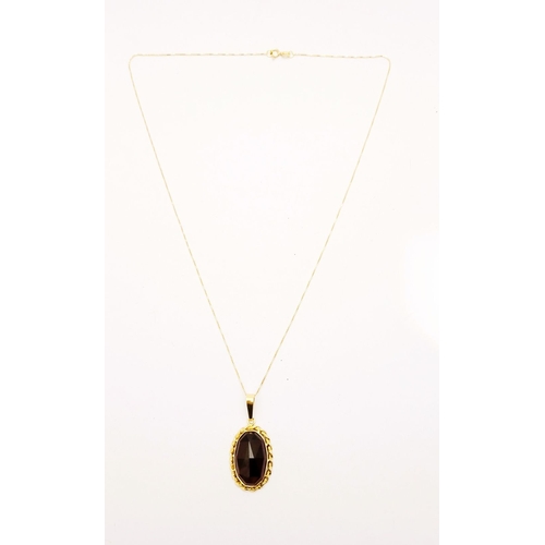 46 - AN ATTRACTIVE 14CT YELLOW GOLD GARNET PENDANT NECKLACE, lovely delicate link chain holds the oval sh... 