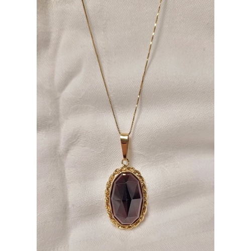 46 - AN ATTRACTIVE 14CT YELLOW GOLD GARNET PENDANT NECKLACE, lovely delicate link chain holds the oval sh... 
