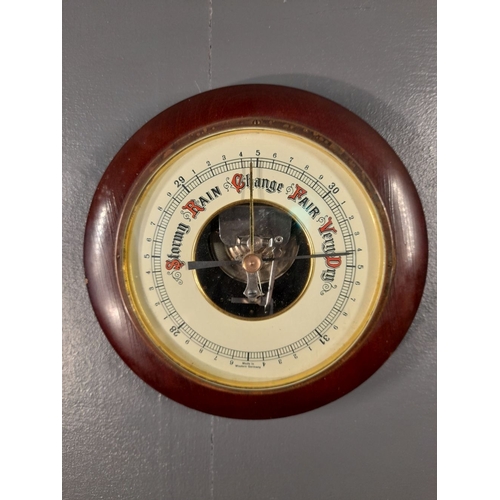 65 - A VINTAGE ANEROID BAROMETER, made in West Germany. Dimensions: 19cm diameter approx.
