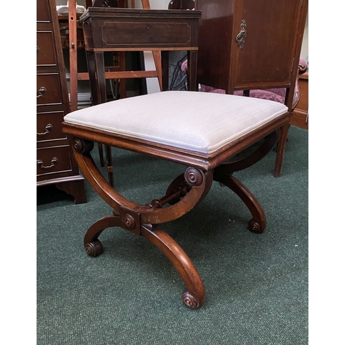 66 - A 19TH CENTURY MAHOGANY AND UPHOLSTERED STOOL the square upholstered seat on X-shaped supports with ... 