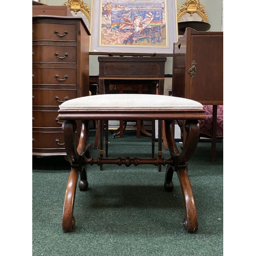 66 - A 19TH CENTURY MAHOGANY AND UPHOLSTERED STOOL the square upholstered seat on X-shaped supports with ... 