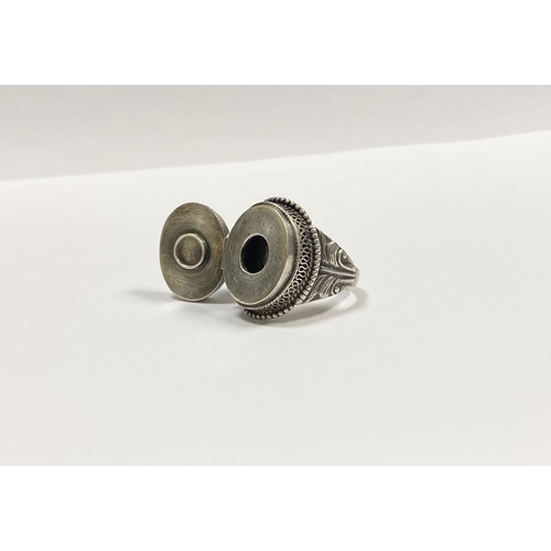 72 - A STERLING SILVER & TURQUOISE ‘LOCKET/POISON’ RING, featuring oval cut turquoise bezel set in raised... 