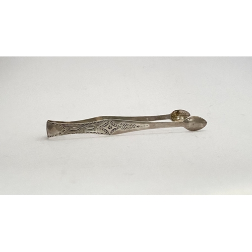 73 - A FINE GEORGE III SILVER SUGAR TONGS, with intricate bright cut engraving featuring diamond and blan... 