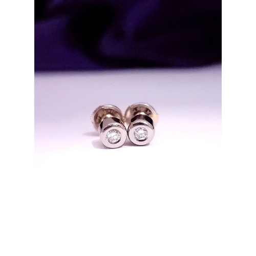 74 - A PAIR OF DIAMOND STUD EARRINGS each in a roll-over cylindrical column setting, with ALPA secure bac... 