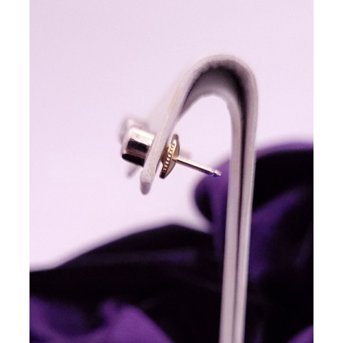 74 - A PAIR OF DIAMOND STUD EARRINGS each in a roll-over cylindrical column setting, with ALPA secure bac... 