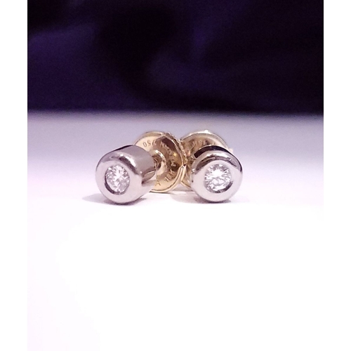 74 - A PAIR OF DIAMOND STUD EARRINGS each in a roll-over cylindrical column setting, with ALPA secure bac... 