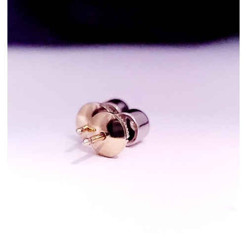 74 - A PAIR OF DIAMOND STUD EARRINGS each in a roll-over cylindrical column setting, with ALPA secure bac... 