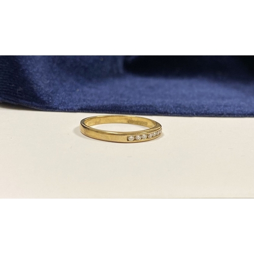 80 - A BEAUTIFUL 9CT YELLOW GOLD SEVEN STONE DIAMOND RING, the seven round cut diamonds are channel set w... 