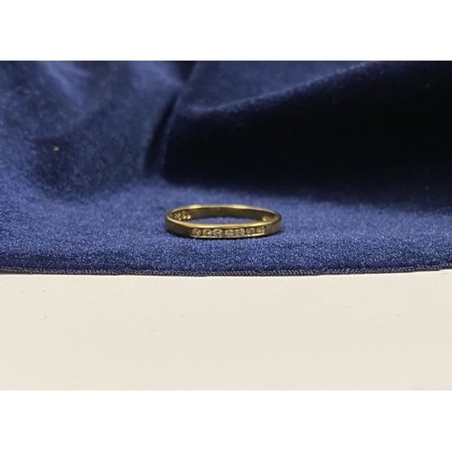 80 - A BEAUTIFUL 9CT YELLOW GOLD SEVEN STONE DIAMOND RING, the seven round cut diamonds are channel set w... 