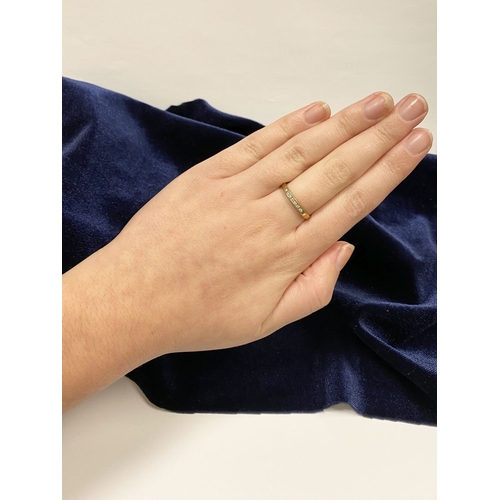 80 - A BEAUTIFUL 9CT YELLOW GOLD SEVEN STONE DIAMOND RING, the seven round cut diamonds are channel set w... 