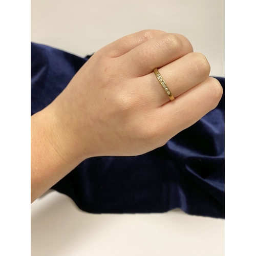 80 - A BEAUTIFUL 9CT YELLOW GOLD SEVEN STONE DIAMOND RING, the seven round cut diamonds are channel set w... 