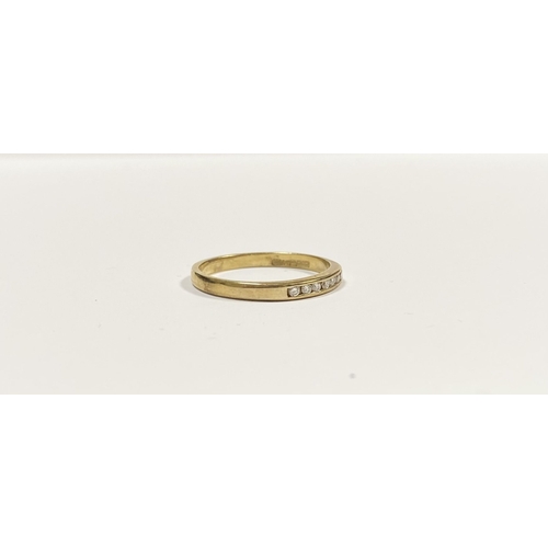 80 - A BEAUTIFUL 9CT YELLOW GOLD SEVEN STONE DIAMOND RING, the seven round cut diamonds are channel set w... 