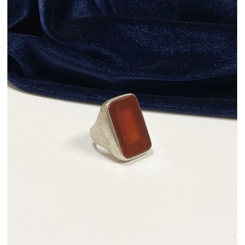 81 - A JOACHIM S’PALIU SPAIN STERLING SILVER CARNELIAN RING, with large rectangular cut Carnelian with ro... 