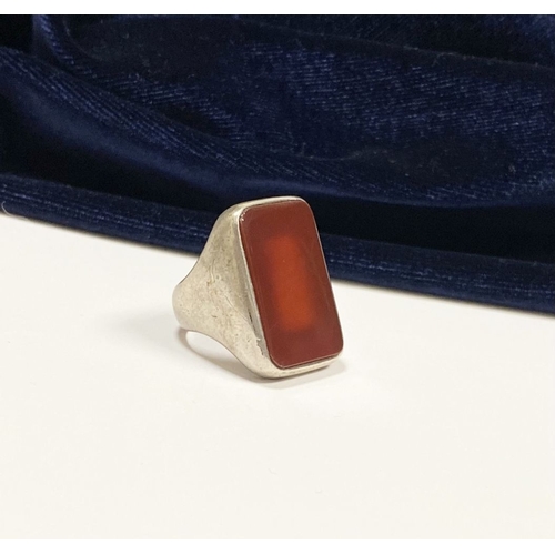 81 - A JOACHIM S’PALIU SPAIN STERLING SILVER CARNELIAN RING, with large rectangular cut Carnelian with ro... 