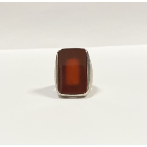 81 - A JOACHIM S’PALIU SPAIN STERLING SILVER CARNELIAN RING, with large rectangular cut Carnelian with ro... 