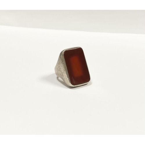 81 - A JOACHIM S’PALIU SPAIN STERLING SILVER CARNELIAN RING, with large rectangular cut Carnelian with ro... 