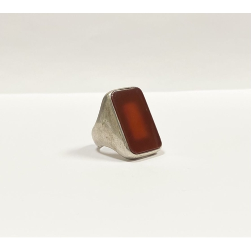 81 - A JOACHIM S’PALIU SPAIN STERLING SILVER CARNELIAN RING, with large rectangular cut Carnelian with ro... 
