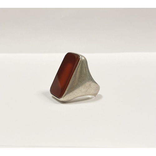 81 - A JOACHIM S’PALIU SPAIN STERLING SILVER CARNELIAN RING, with large rectangular cut Carnelian with ro... 