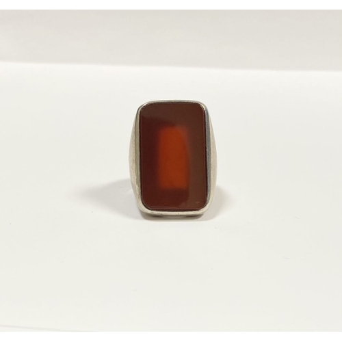 81 - A JOACHIM S’PALIU SPAIN STERLING SILVER CARNELIAN RING, with large rectangular cut Carnelian with ro... 