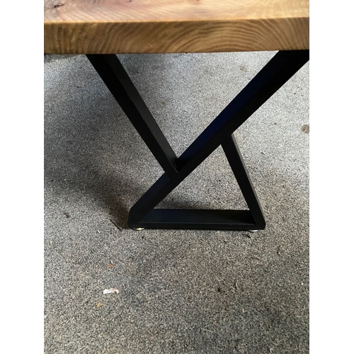 85 - A WALNUT RECLAIMED WOOD COFFEE TABLE, raised on metal base with supports to either side, dimensions:... 