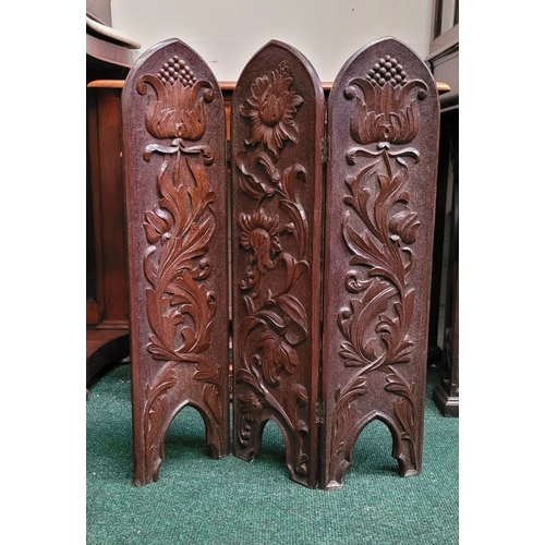 88 - A BEAUTIFUL HAND CARVED FOLDING WOODEN SCREEN, the front of each of the three panels decorated with ... 
