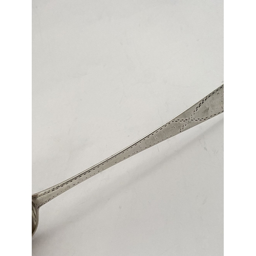 9 - A RARE IRISH – LIMERICK – GEORGE III SILVER SERVING SPOON, by Maurice Fitzgerald c.1785. The handle ... 