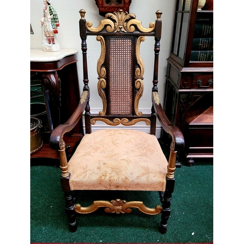 93 - A JACOBEAN REVIVAL STYLE CANE BACKED CARVED ARM CHAIR, the crest rail with beautiful carved Prince o... 