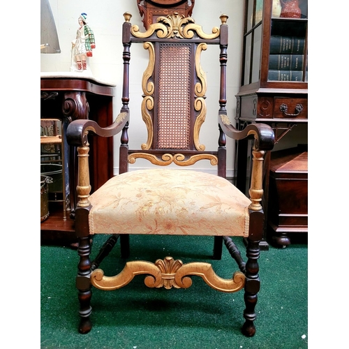 93 - A JACOBEAN REVIVAL STYLE CANE BACKED CARVED ARM CHAIR, the crest rail with beautiful carved Prince o... 
