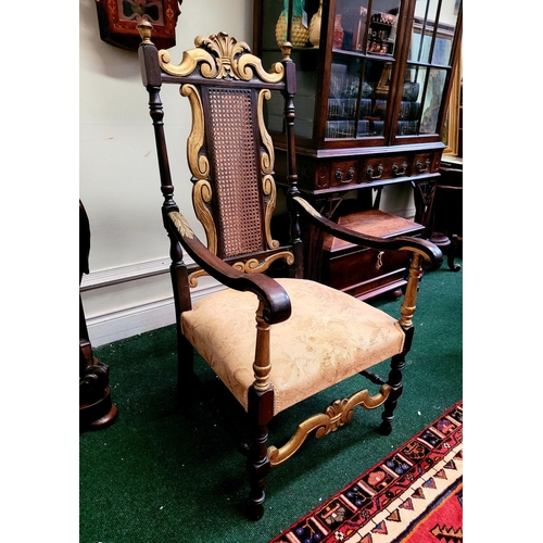 93 - A JACOBEAN REVIVAL STYLE CANE BACKED CARVED ARM CHAIR, the crest rail with beautiful carved Prince o... 