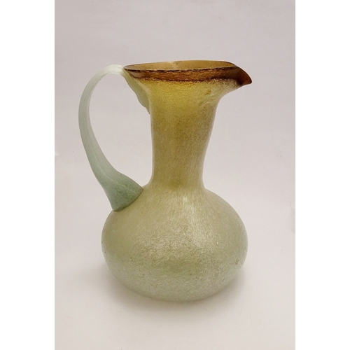 96 - A VINTAGE EARLY 20TH CENTURY ‘STRETCH-GLASS’ PITCHER, the beautifully formed glass pitcher has a cur... 