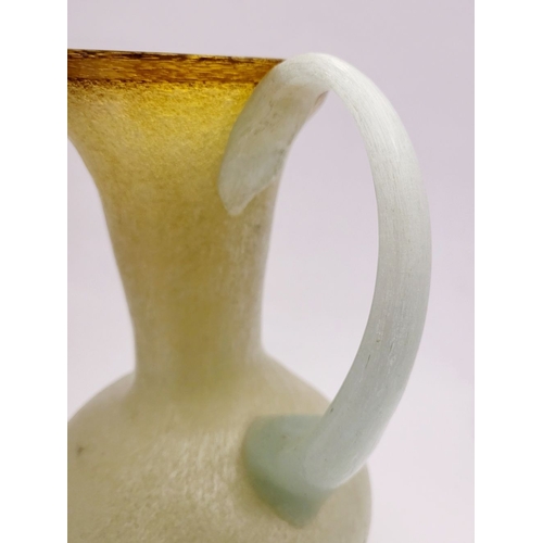 96 - A VINTAGE EARLY 20TH CENTURY ‘STRETCH-GLASS’ PITCHER, the beautifully formed glass pitcher has a cur... 
