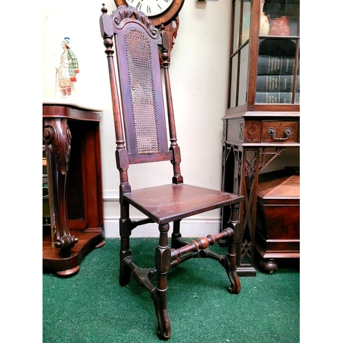 98 - A TALL BACKED SINGLE WILLIAM & MARY OAK HALL CHAIR, with a carved domed crest rail with woven cane b... 