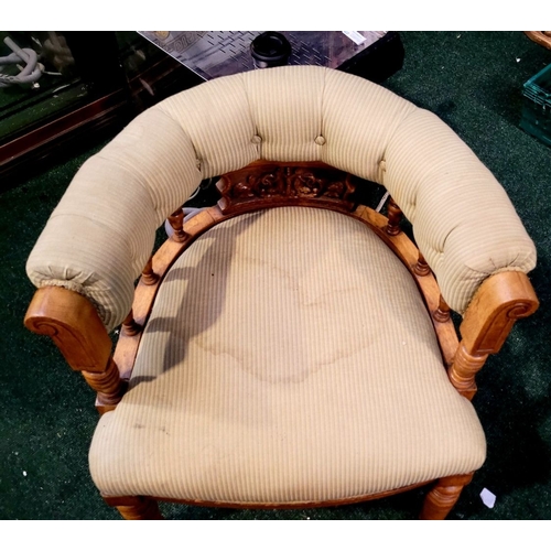 104 - A LATE 19TH CENTURY OAK CAPTAINS CHAIR, with curved padded & buttoned back/armrest raised on ring tu... 