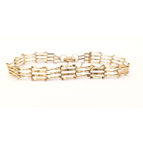 109 - A DELICATE 9CT GOLD GATE LINK BRACELET, with heart shaped lock clasp with security chain attached. L... 