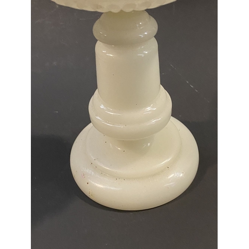 119 - AN ANTIQUE MILK GLASS OIL LAMP, the font with moulded flowers surrounding, on Column base on circula... 