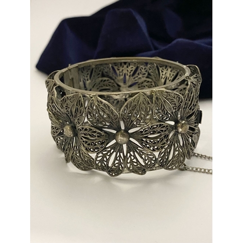 122 - A VINTAGE LARGE BARTEK FILIGREE BANGLE BRACELET, beautiful intricate floral design surrounding in si... 