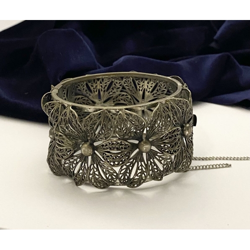 122 - A VINTAGE LARGE BARTEK FILIGREE BANGLE BRACELET, beautiful intricate floral design surrounding in si... 