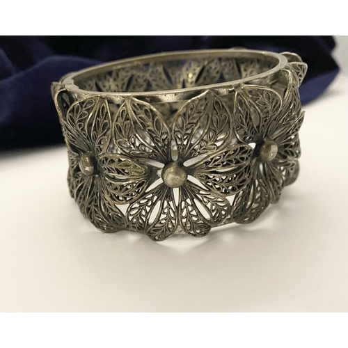 122 - A VINTAGE LARGE BARTEK FILIGREE BANGLE BRACELET, beautiful intricate floral design surrounding in si... 