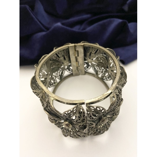 122 - A VINTAGE LARGE BARTEK FILIGREE BANGLE BRACELET, beautiful intricate floral design surrounding in si... 