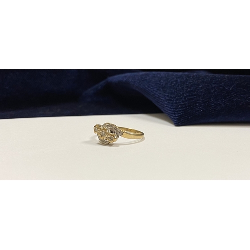 132 - A PRETTY 9CT YELLOW GOLD DIAMOND RING, with three round cut diamonds in illusion setting to centre, ... 