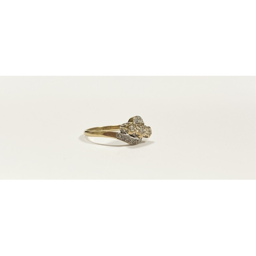 132 - A PRETTY 9CT YELLOW GOLD DIAMOND RING, with three round cut diamonds in illusion setting to centre, ... 