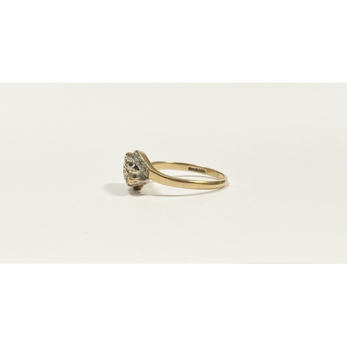 132 - A PRETTY 9CT YELLOW GOLD DIAMOND RING, with three round cut diamonds in illusion setting to centre, ... 