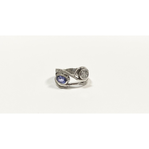 14 - A STUNNING HANDMADE PLATINUM DIAMOND AND TANZANITE RING, with beautiful round brilliant cut diamond ... 