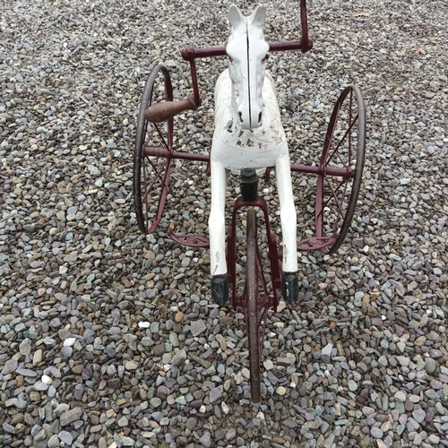 141 - A VICTORIAN ‘HOBBY HORSE’, in working order, dating from circa 1890. 67cm tall.