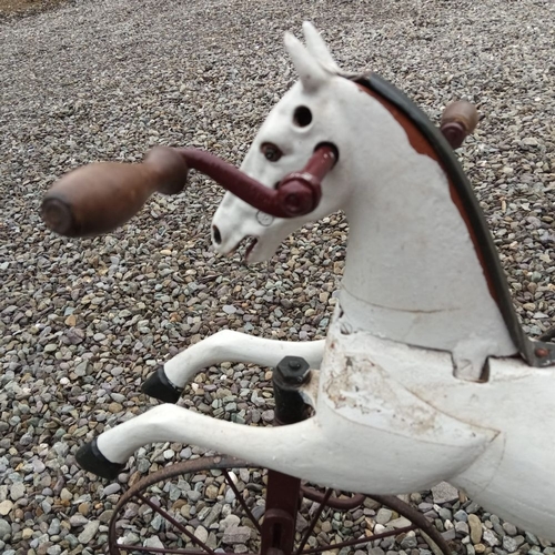 141 - A VICTORIAN ‘HOBBY HORSE’, in working order, dating from circa 1890. 67cm tall.