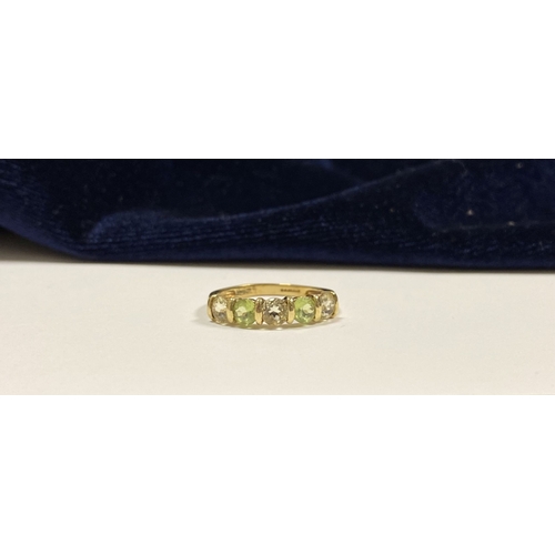 148 - A PRETTY 9CT YELLOW GOLD FIVE STONE RING, with five round cut gemstones alternating in colour in rai... 