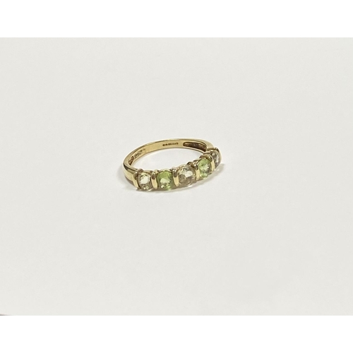 148 - A PRETTY 9CT YELLOW GOLD FIVE STONE RING, with five round cut gemstones alternating in colour in rai... 