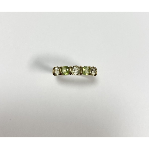 148 - A PRETTY 9CT YELLOW GOLD FIVE STONE RING, with five round cut gemstones alternating in colour in rai... 