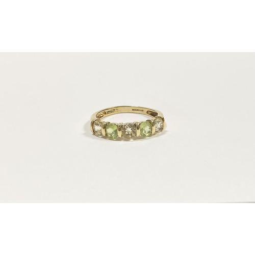 148 - A PRETTY 9CT YELLOW GOLD FIVE STONE RING, with five round cut gemstones alternating in colour in rai... 