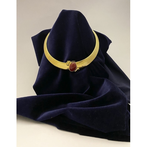 149 - A VINTAGE MONET GOLD TONE OMEGA COLLAR NECKLACE, c.1980, the gold-tone collar featuring an oval-shap... 